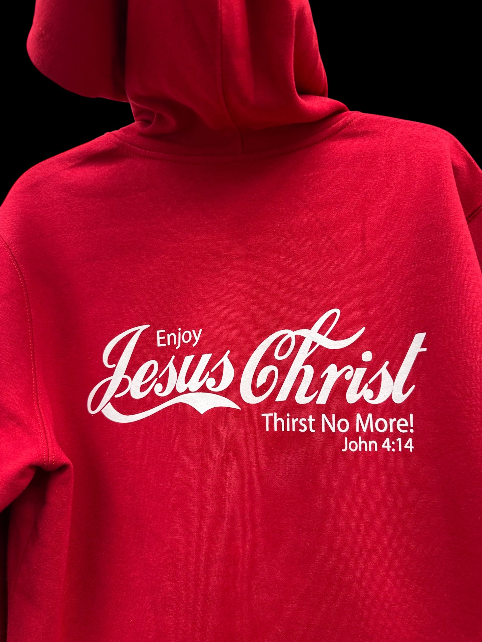 Red hoodie with white text 'Enjoy Jesus Christ Thirst No More! John 4:14' on a black background